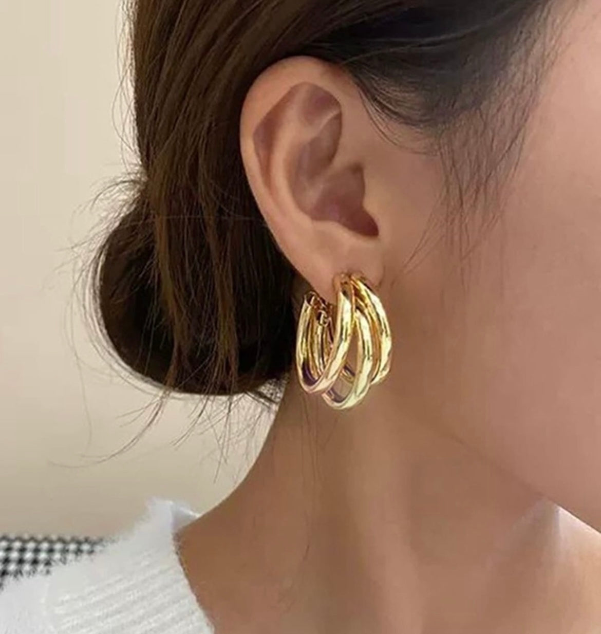 Twisted triple layered hoops