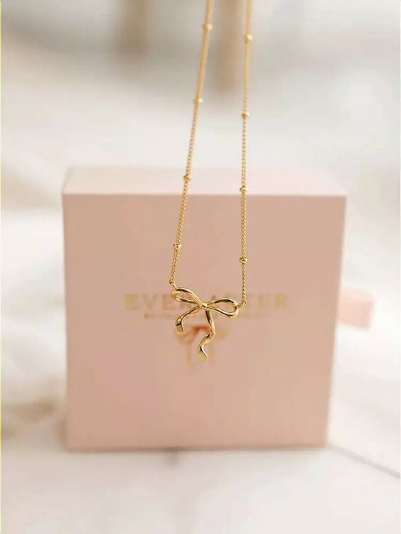 Infinity bow charm necklace