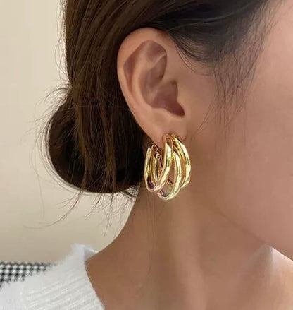 Twisted triple layered hoops