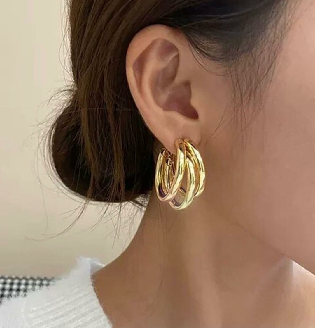Twisted triple layered hoops