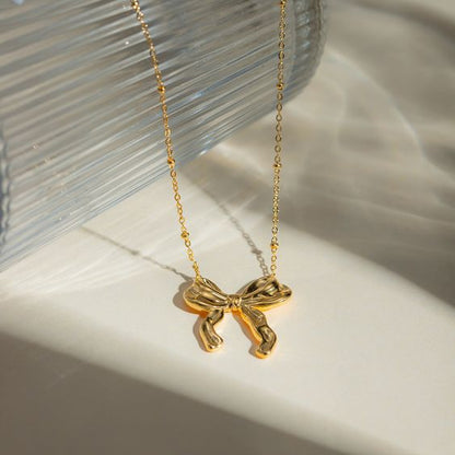 Infinity bow charm necklace
